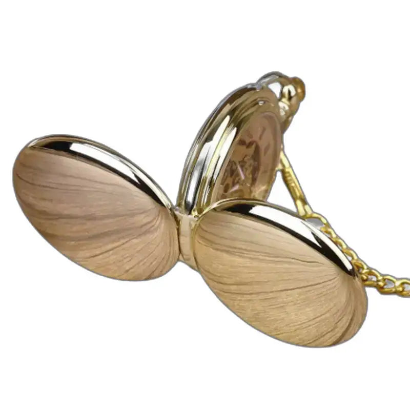 Luxe zwartgouden mechanisch zakhorloge met gouden ketting en open gouden kast